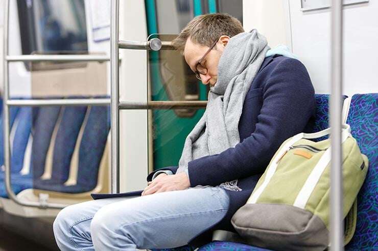 exhausted-man-sleeping-in-subway-train-on-way-to-work-as-result-of-being-sleep-deprived-740