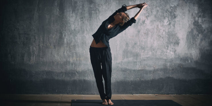 woman in yoga standing side bend